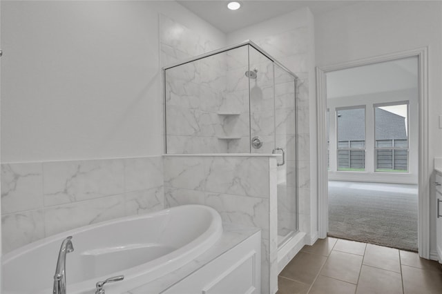 545 Oakmoss St, Little Elm, TX 76227 - full bathroom featuring a bath, a stall shower, tile patterned floors, and recessed lighting