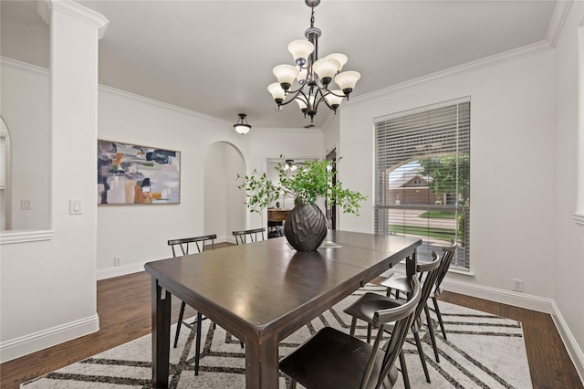 1021 Tara Dr, Burleson, TX 76028 - dining area with a chandelier, arched walkways, ornamental molding, and wood finished floors