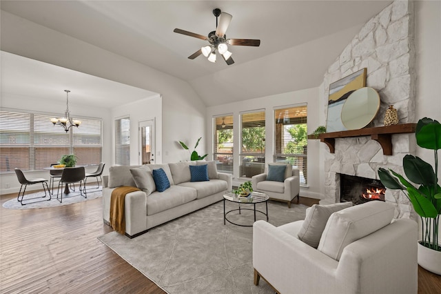 1021 Tara Dr, Burleson, TX 76028 - living room with lofted ceiling, a chandelier, a fireplace, ceiling fan, and wood finished floors