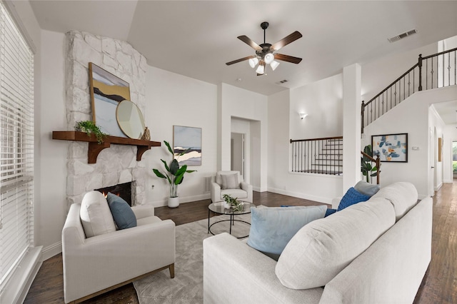1021 Tara Dr, Burleson, TX 76028 - living area featuring ceiling fan, wood finished floors, and a fireplace