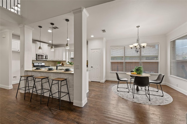 1021 Tara Dr, Burleson, TX 76028 - kitchen with appliances with stainless steel finishes, white cabinetry, healthy amount of natural light, crown molding, and recessed lighting