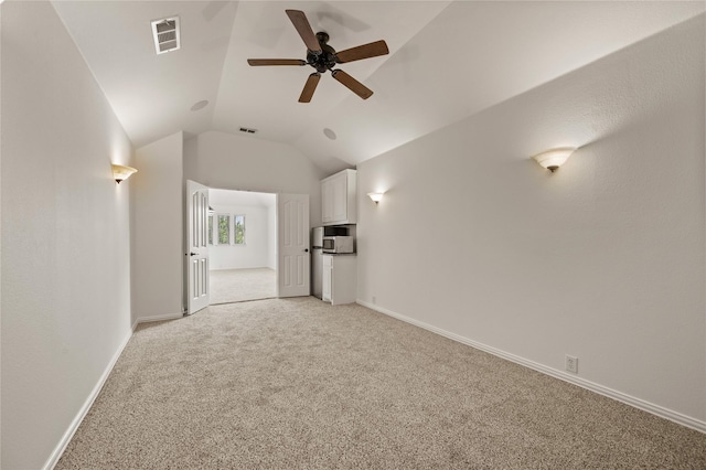 1021 Tara Dr, Burleson, TX 76028 - unfurnished living room featuring light colored carpet, a ceiling fan, and vaulted ceiling
