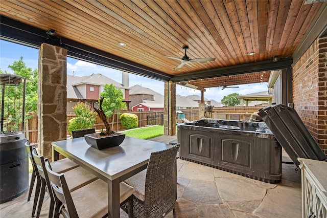 1021 Tara Dr, Burleson, TX 76028 - fenced backyard with outdoor dining area, a patio, and a ceiling fan