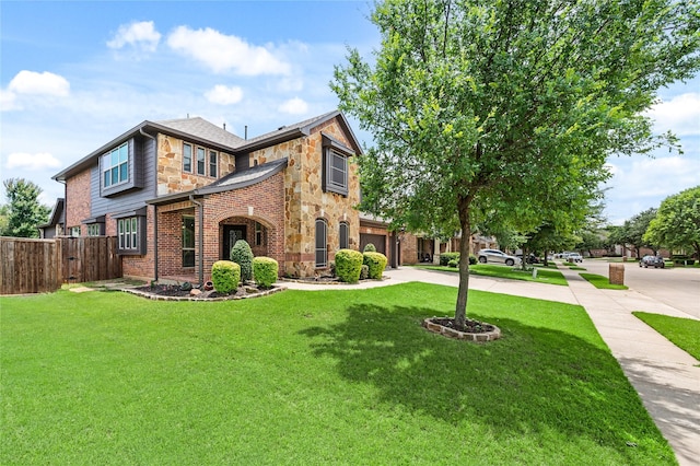 1021 Tara Dr, Burleson, TX 76028 - view of front of home featuring stone siding, driveway, an attached garage, and brick siding
