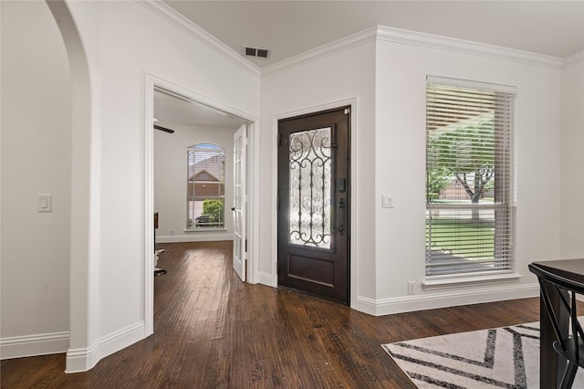 1021 Tara Dr, Burleson, TX 76028 - entryway with arched walkways, dark wood-style flooring, and ornamental molding