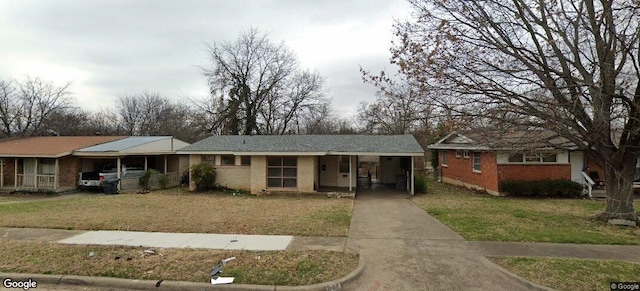 1214 Adelaide Dr, Dallas, TX 75216 - ranch-style home featuring brick siding, concrete driveway, a front yard, an attached carport, and covered porch