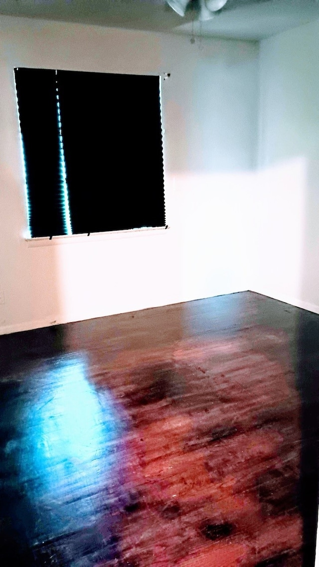 1214 Adelaide Dr, Dallas, TX 75216 - unfurnished room with wood finished floors and ceiling fan