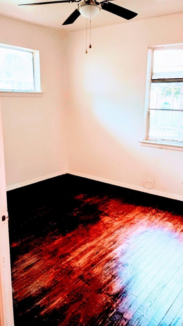 1214 Adelaide Dr, Dallas, TX 75216 - unfurnished room with wood-type flooring, ceiling fan, and baseboards