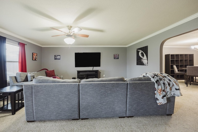3428 Baby Doe Ct, Fort Worth, TX 76137 - living room featuring carpet flooring, crown molding, arched walkways, and a ceiling fan