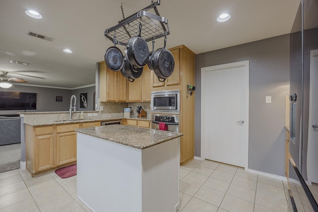 3428 Baby Doe Ct, Fort Worth, TX 76137 - kitchen with a sink, stainless steel appliances, a peninsula, ceiling fan, and light tile patterned floors