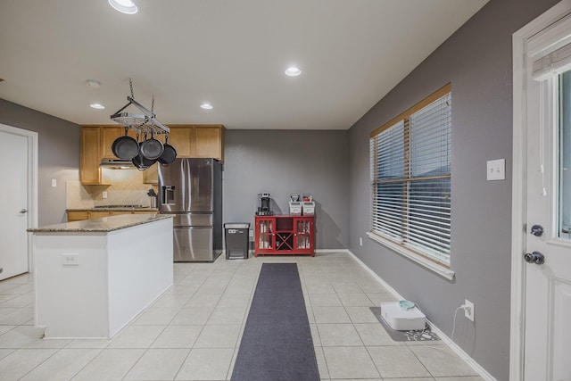 3428 Baby Doe Ct, Fort Worth, TX 76137 - kitchen with stainless steel fridge with ice dispenser, tasteful backsplash, recessed lighting, light tile patterned flooring, and light stone countertops