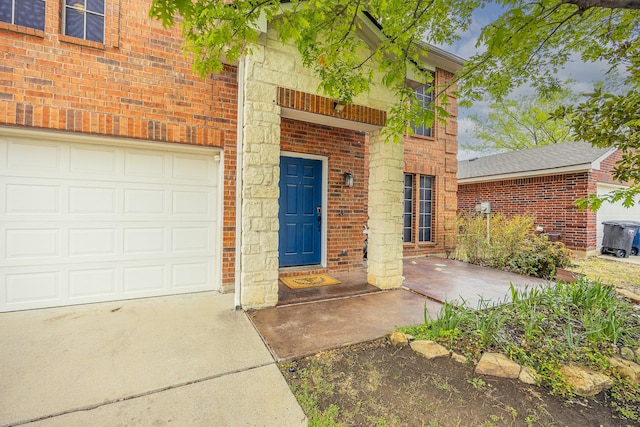 3428 Baby Doe Ct, Fort Worth, TX 76137 - doorway to property with brick siding, concrete driveway, a garage, and stone siding