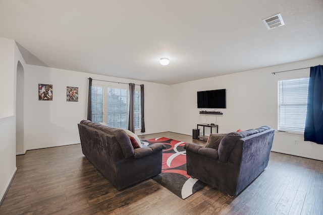 3428 Baby Doe Ct, Fort Worth, TX 76137 - living area with wood finished floors, arched walkways, and baseboards