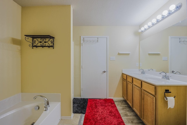 3428 Baby Doe Ct, Fort Worth, TX 76137 - bathroom with double vanity, a bath, and baseboards