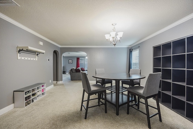 3428 Baby Doe Ct, Fort Worth, TX 76137 - dining area with arched walkways, a chandelier, ornamental molding, carpet floors, and a textured ceiling