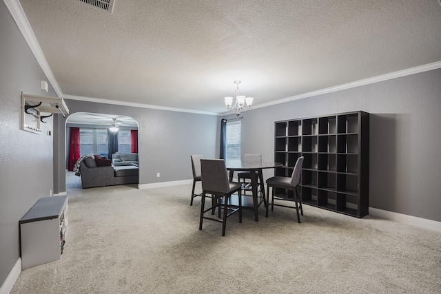 3428 Baby Doe Ct, Fort Worth, TX 76137 - carpeted dining area featuring arched walkways, a textured ceiling, crown molding, a chandelier, and baseboards