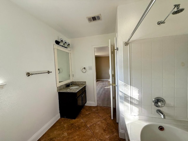 2056 Pecan Creek Dr, Mesquite, TX 75181 - full bathroom with vanity, tile patterned flooring, baseboards, and shower / washtub combination
