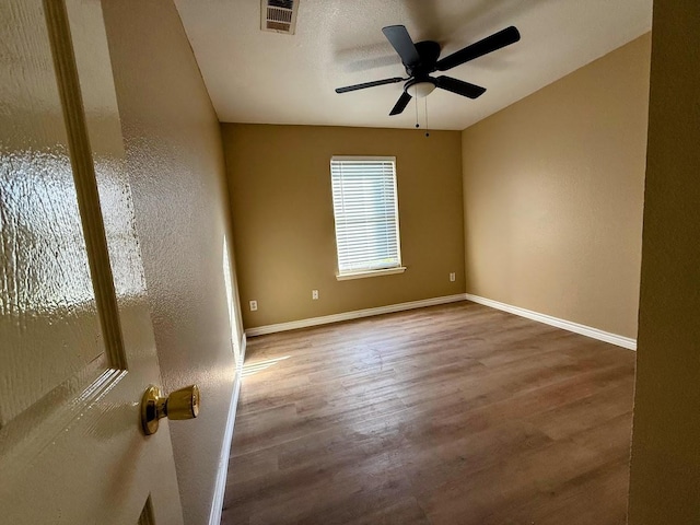 2056 Pecan Creek Dr, Mesquite, TX 75181 - empty room with wood finished floors, baseboards, and a ceiling fan