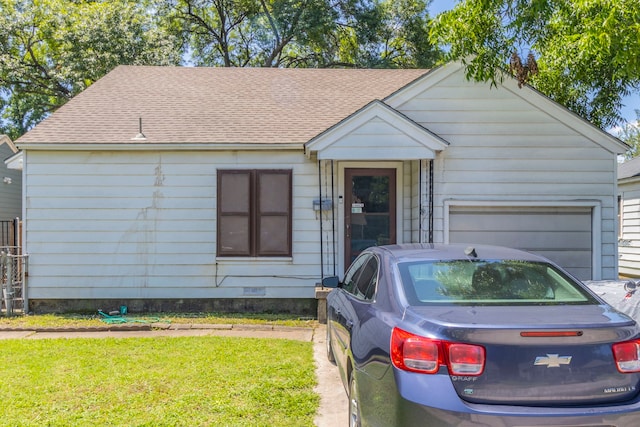 1213 Pine St, Grand Prairie, TX 75050 - view of front of property with a garage, a shingled roof, and a front yard