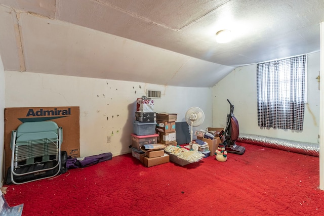 1213 Pine St, Grand Prairie, TX 75050 - game room with vaulted ceiling and carpet flooring