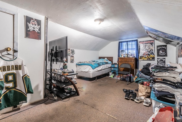 1213 Pine St, Grand Prairie, TX 75050 - carpeted bedroom with lofted ceiling and a textured ceiling