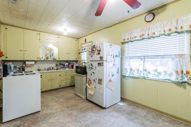 1213 Pine St, Grand Prairie, TX 75050 - kitchen featuring white appliances, a sink, ceiling fan, washer / clothes dryer, and cream cabinets