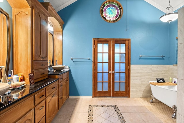 1578 Stainback Rd, Red Oak, TX 75154 - full bath with ornamental molding, french doors, tile patterned floors, a soaking tub, and vanity