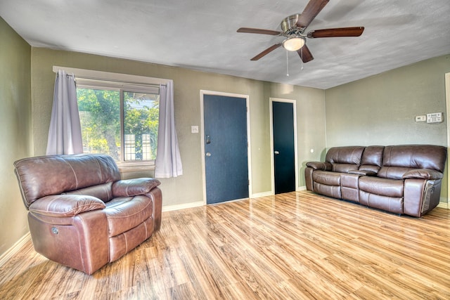 517 Pleasant Oaks Dr, Dallas, TX 75217 - living room with wood finished floors, ceiling fan, and baseboards