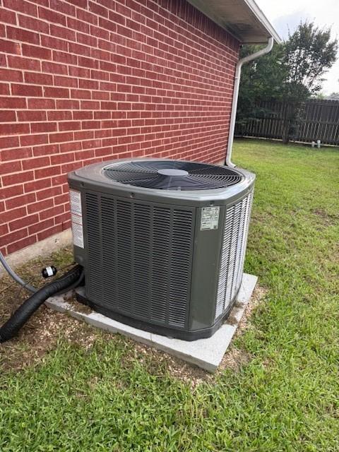 502 E College St, Leonard, TX 75452 - exterior view of central AC and brick siding