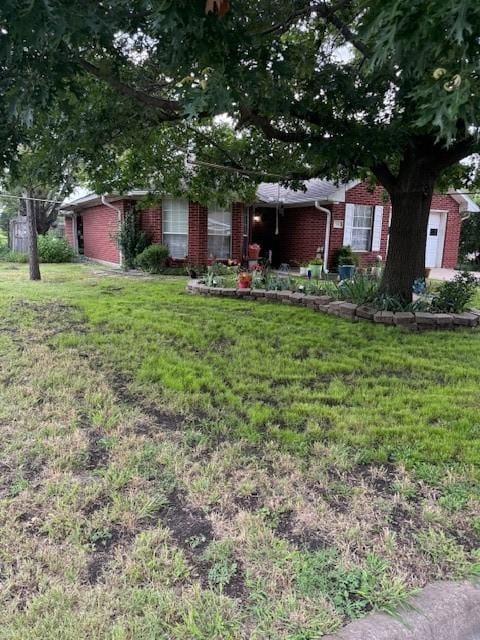502 E College St, Leonard, TX 75452 - view of property hidden behind natural elements with brick siding and a front lawn