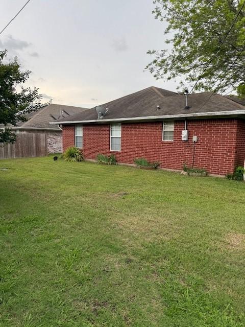 502 E College St, Leonard, TX 75452 - rear view of house featuring brick siding