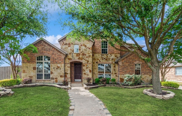 7310 Waterbury Dr, Rowlett, TX 75089 - tudor-style house featuring stone siding and brick siding