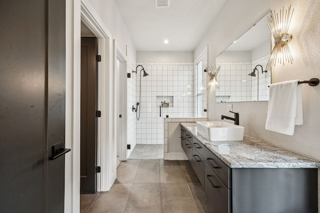 1921 Washington Ave, Fort Worth, TX 76110 - full bath featuring a tile shower, vanity, and tile patterned flooring
