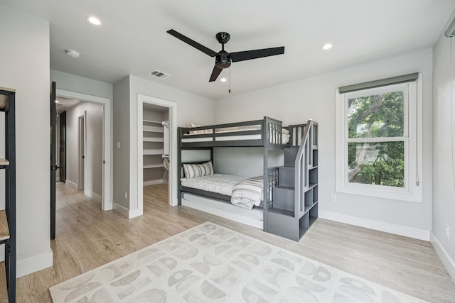 1921 Washington Ave, Fort Worth, TX 76110 - bedroom featuring a spacious closet, wood finished floors, recessed lighting, a closet, and a ceiling fan