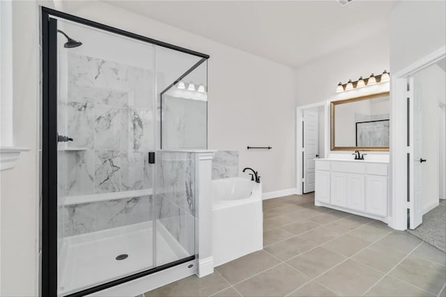 701 Winecup Way, Midlothian, TX 76065 - bathroom with a garden tub, a marble finish shower, vanity, tile patterned floors, and baseboards