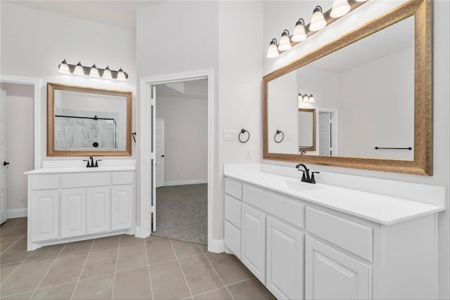 701 Winecup Way, Midlothian, TX 76065 - full bathroom featuring two vanities, tile patterned flooring, a shower, and baseboards