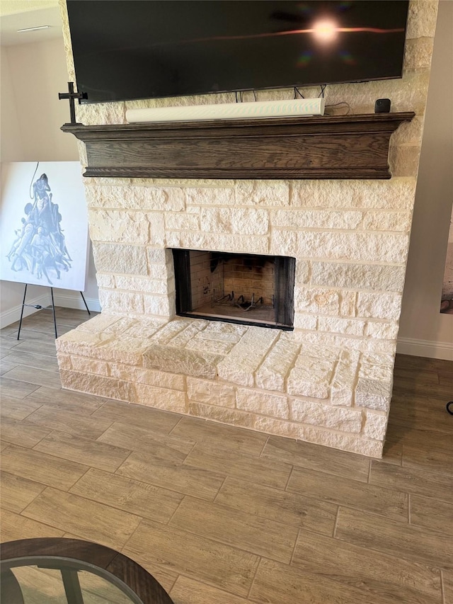 701 Winecup Way, Midlothian, TX 76065 - detailed view of wood finished floors, baseboards, and a fireplace