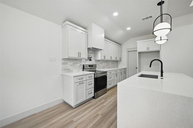 5334 Blackmore Ave, Fort Worth, TX 76107 - kitchen with stainless steel electric range oven, a sink, decorative backsplash, light wood-style flooring, and light countertops