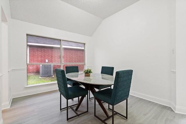 902 Sea Shell Dr, Mesquite, TX 75149 - dining area featuring vaulted ceiling and wood finished floors