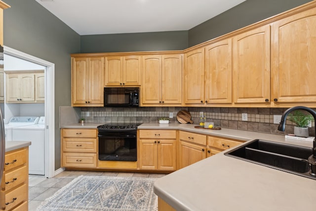 5321 Joe Wilson Rd, Midlothian, TX 76065 - kitchen featuring black appliances, light brown cabinetry, and separate washer and dryer
