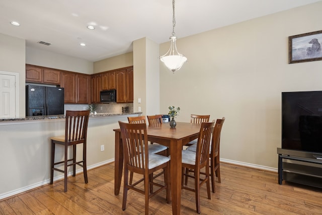 4121 Mckinney Ave Unit 21, Dallas, TX 75204 - dining area with light wood finished floors and recessed lighting