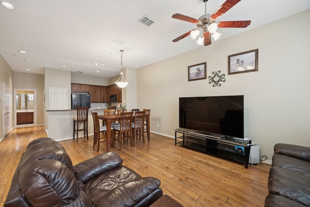 4121 Mckinney Ave Unit 21, Dallas, TX 75204 - living area featuring light wood-style floors, ceiling fan, and recessed lighting