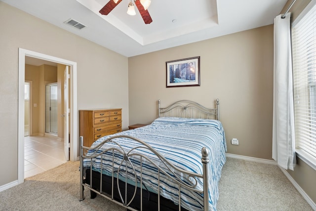4121 Mckinney Ave Unit 21, Dallas, TX 75204 - carpeted bedroom featuring a tray ceiling and a ceiling fan