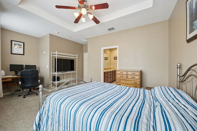 4121 Mckinney Ave Unit 21, Dallas, TX 75204 - carpeted bedroom featuring a tray ceiling, a ceiling fan, connected bathroom, and an office area