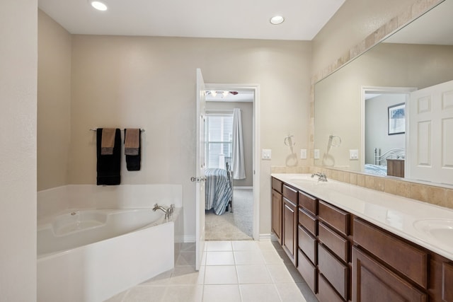 4121 Mckinney Ave Unit 21, Dallas, TX 75204 - ensuite bathroom with double vanity, a garden tub, tile patterned flooring, and recessed lighting
