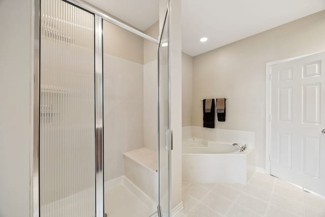 4121 Mckinney Ave Unit 21, Dallas, TX 75204 - full bathroom featuring a bath, a shower stall, tile patterned flooring, and recessed lighting