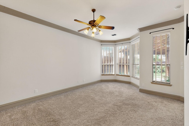 5766 Wellington Ln, Frisco, TX 75033 - spare room featuring crown molding, carpet floors, a ceiling fan, and a smoke detector