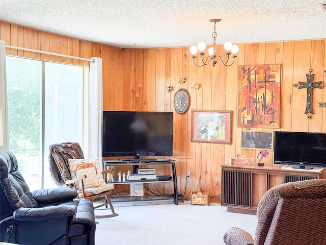 904 W 12th St, Cisco, TX 76437 - living room with wood walls, healthy amount of natural light, a chandelier, and a textured ceiling