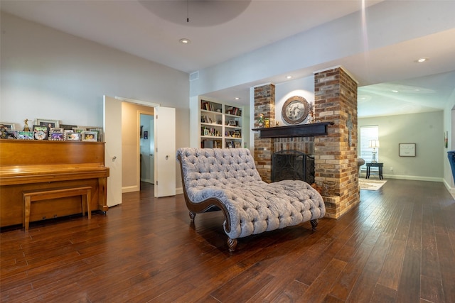 1104 Chesterton Dr, Richardson, TX 75080 - sitting room featuring a brick fireplace, built in features, hardwood / wood-style floors, and recessed lighting