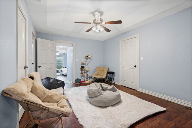 211 Second St, Denton, TX 76201 - living area with a ceiling fan and dark wood-style flooring